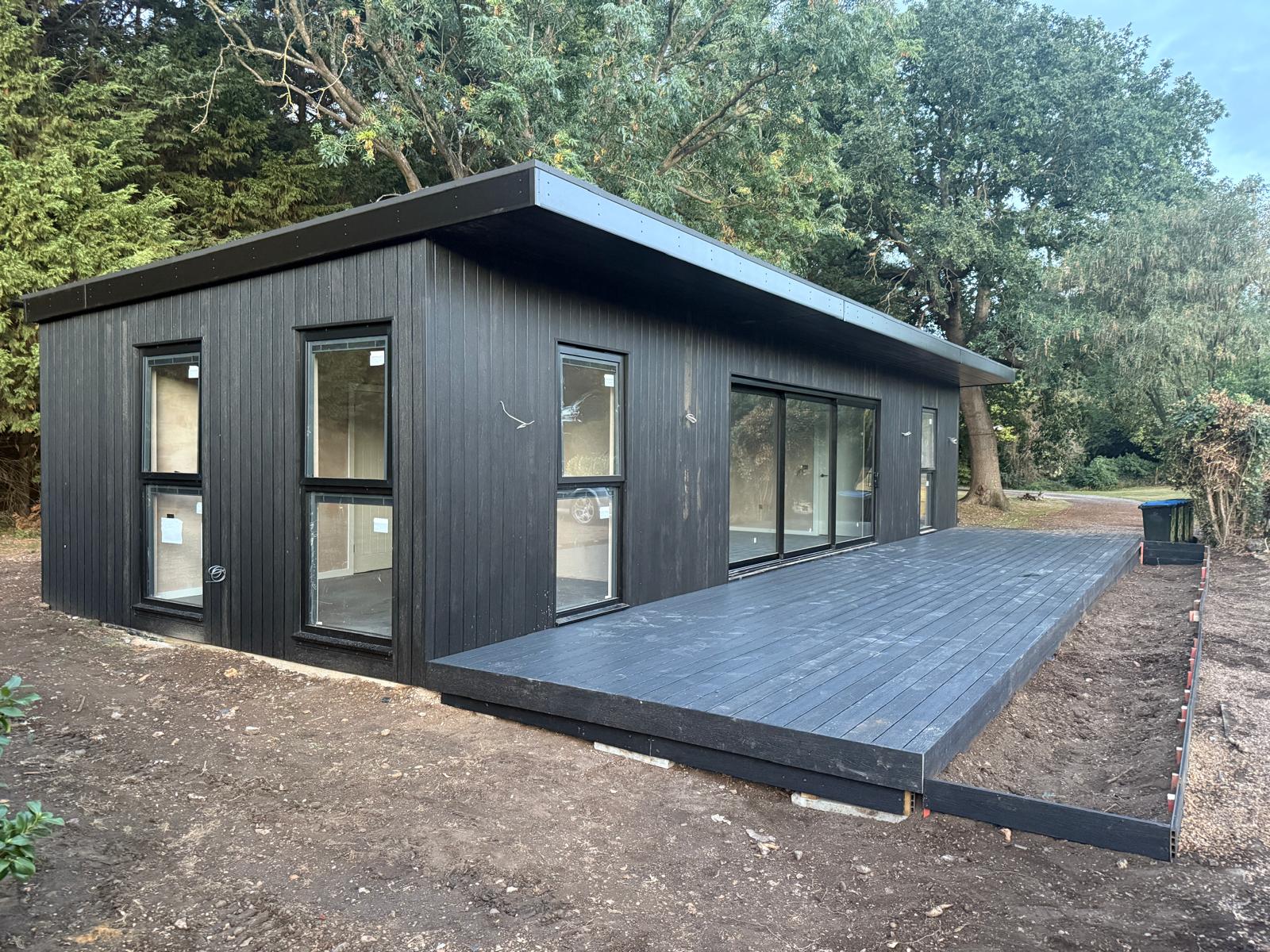Completed composite decking laid in front of the annexe sliding doors