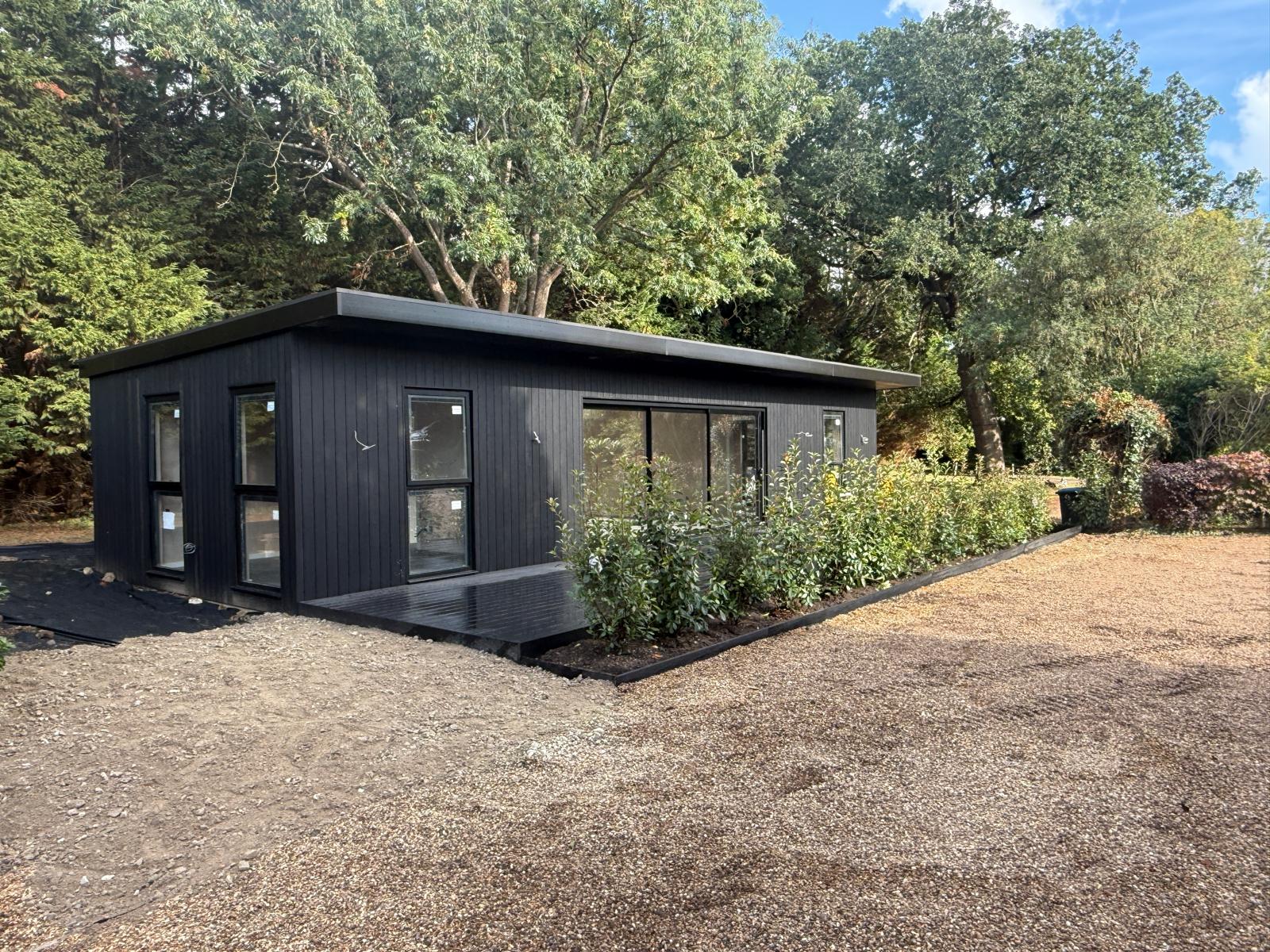 Finished annexe exterior with new planting and gravel landscaping