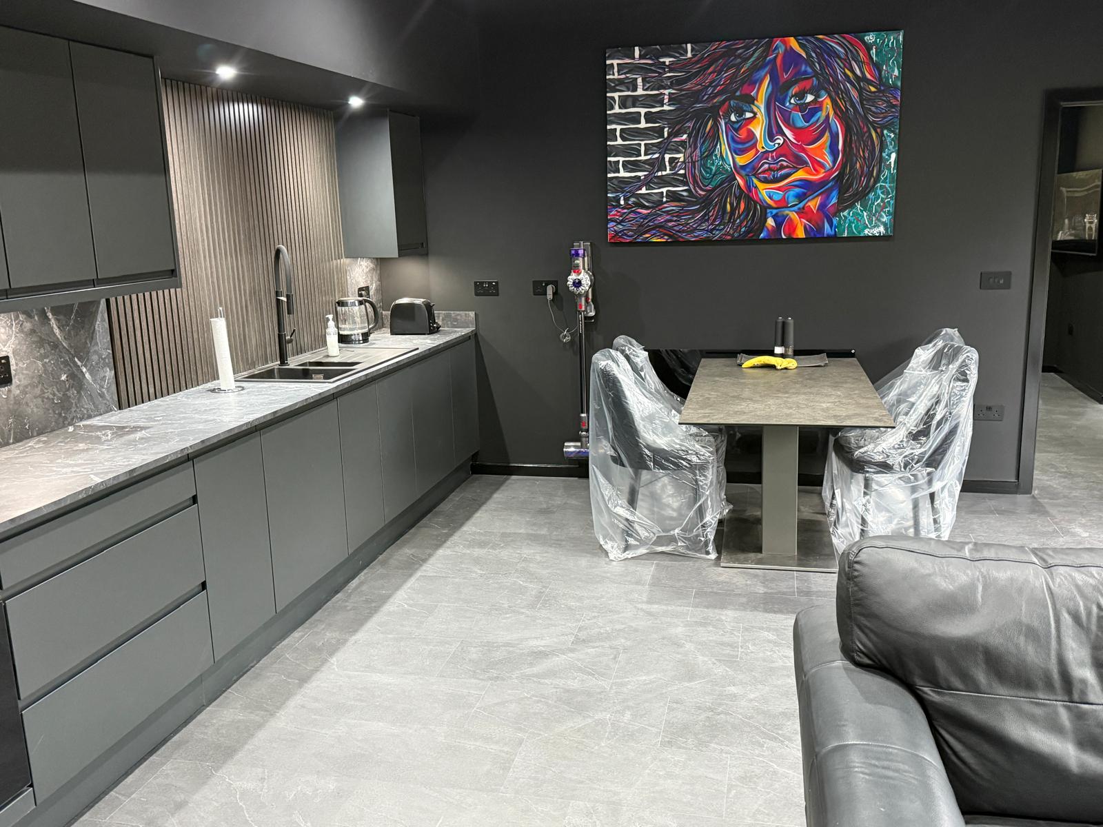 Finished kitchen with dining area and feature artwork in the Thorpe annexe