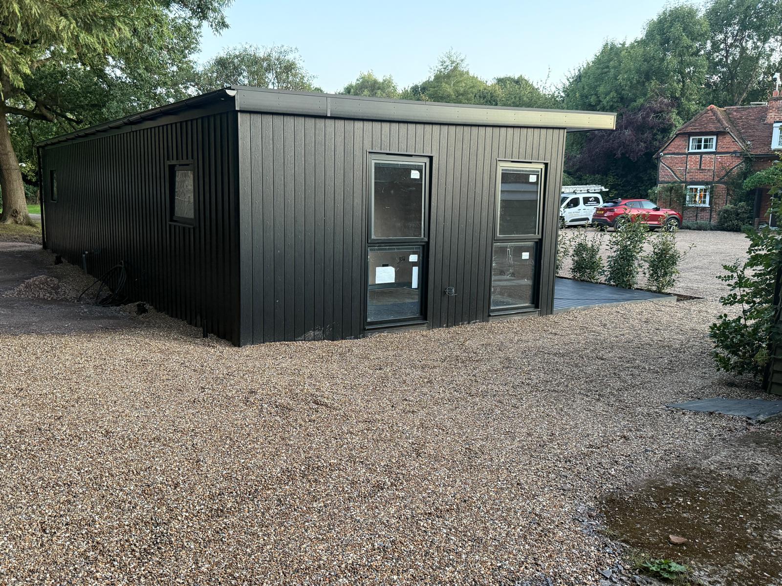 Rear elevation of the finished Thorpe annexe on the gravel driveway